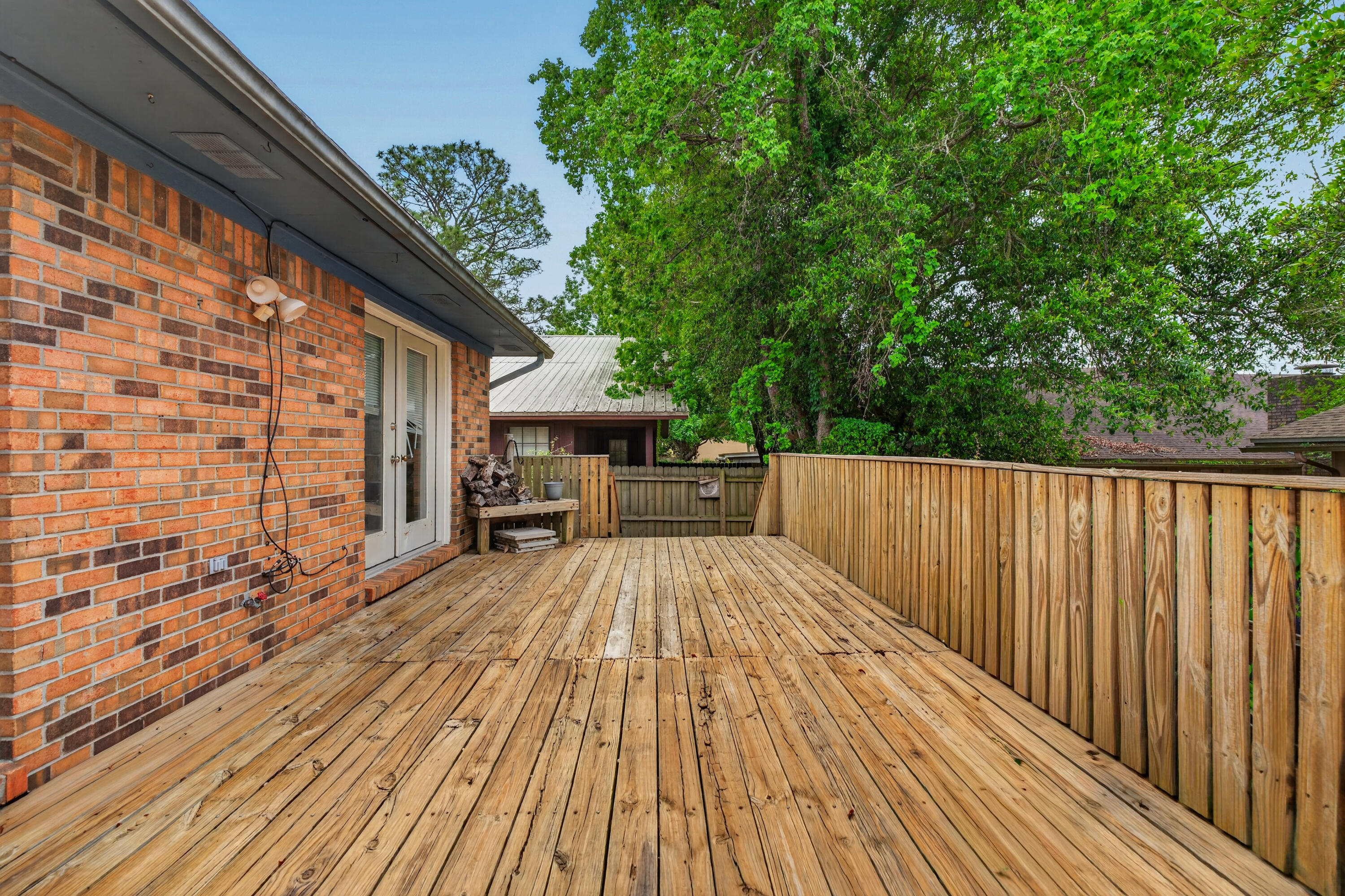 91 Catamaran Lane Shalimar, FL 32579 - Photo 22 of 24 a view of backyard with a deck and seating space