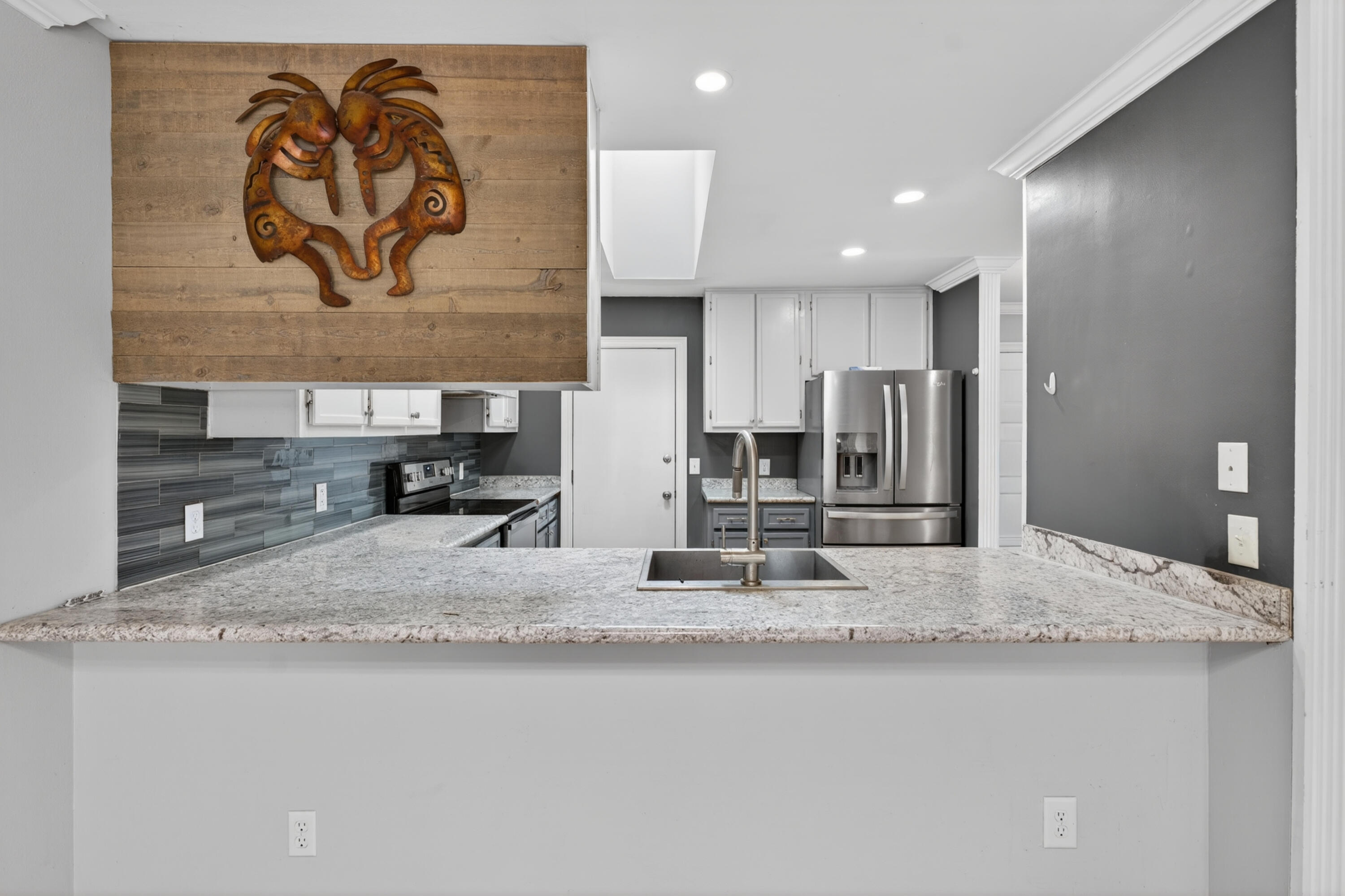 91 Catamaran Lane Shalimar, FL 32579 - Photo 6 of 24 a kitchen with stainless steel appliances granite countertop a sink and a refrigerator