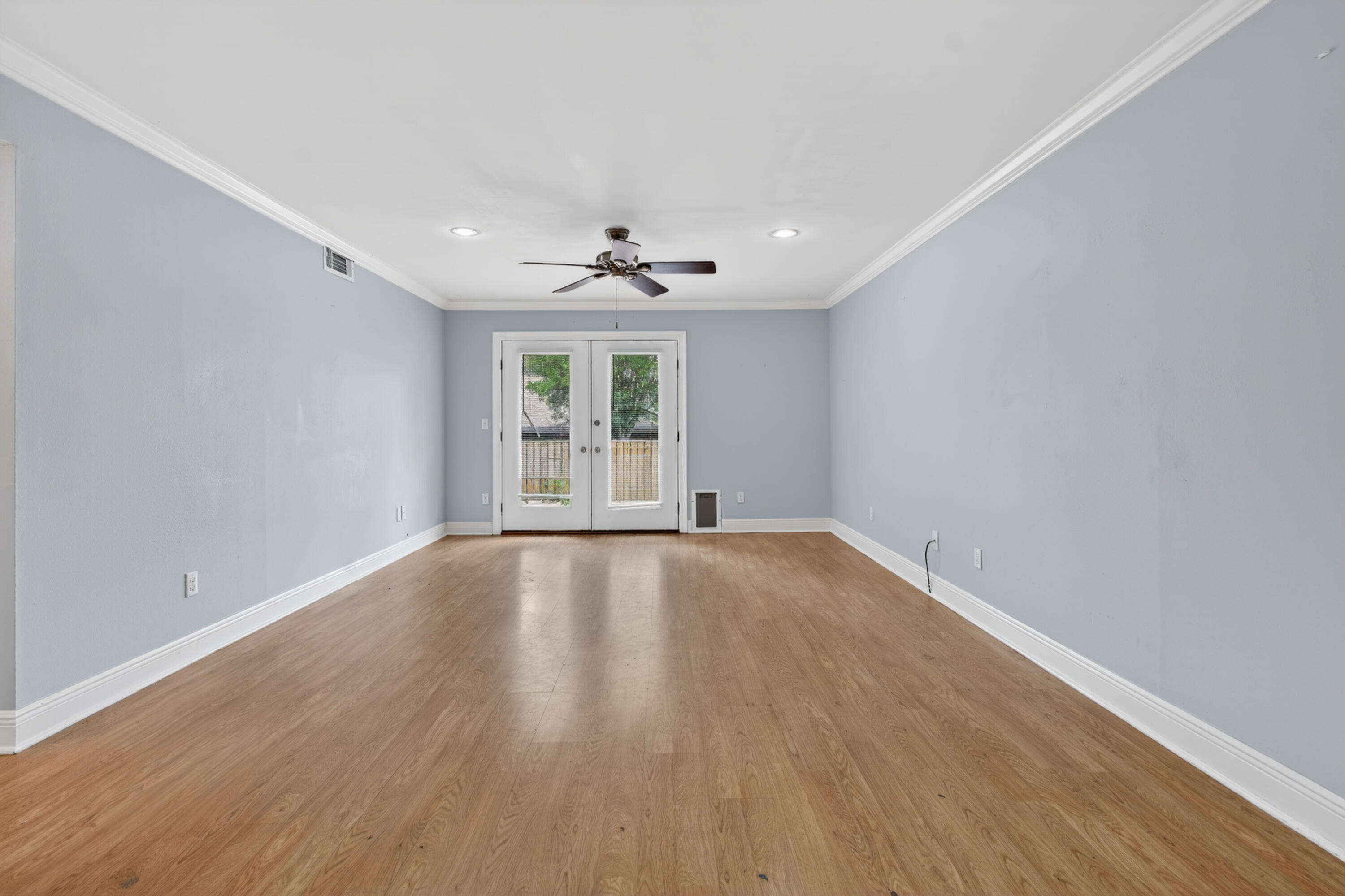 91 Catamaran Lane Shalimar, FL 32579 - Photo 10 of 24 wooden floor in an empty room with a window