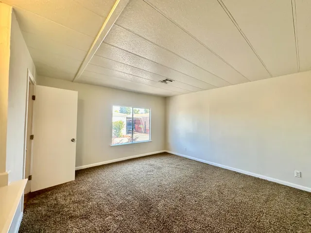 a view of room with window and stairs