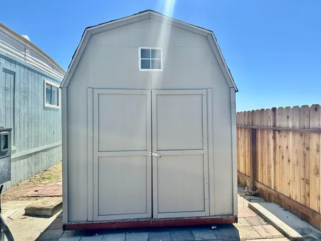 a view of bedroom with wooden floor