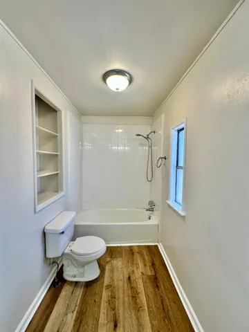 a bathroom with a bathtub and shower