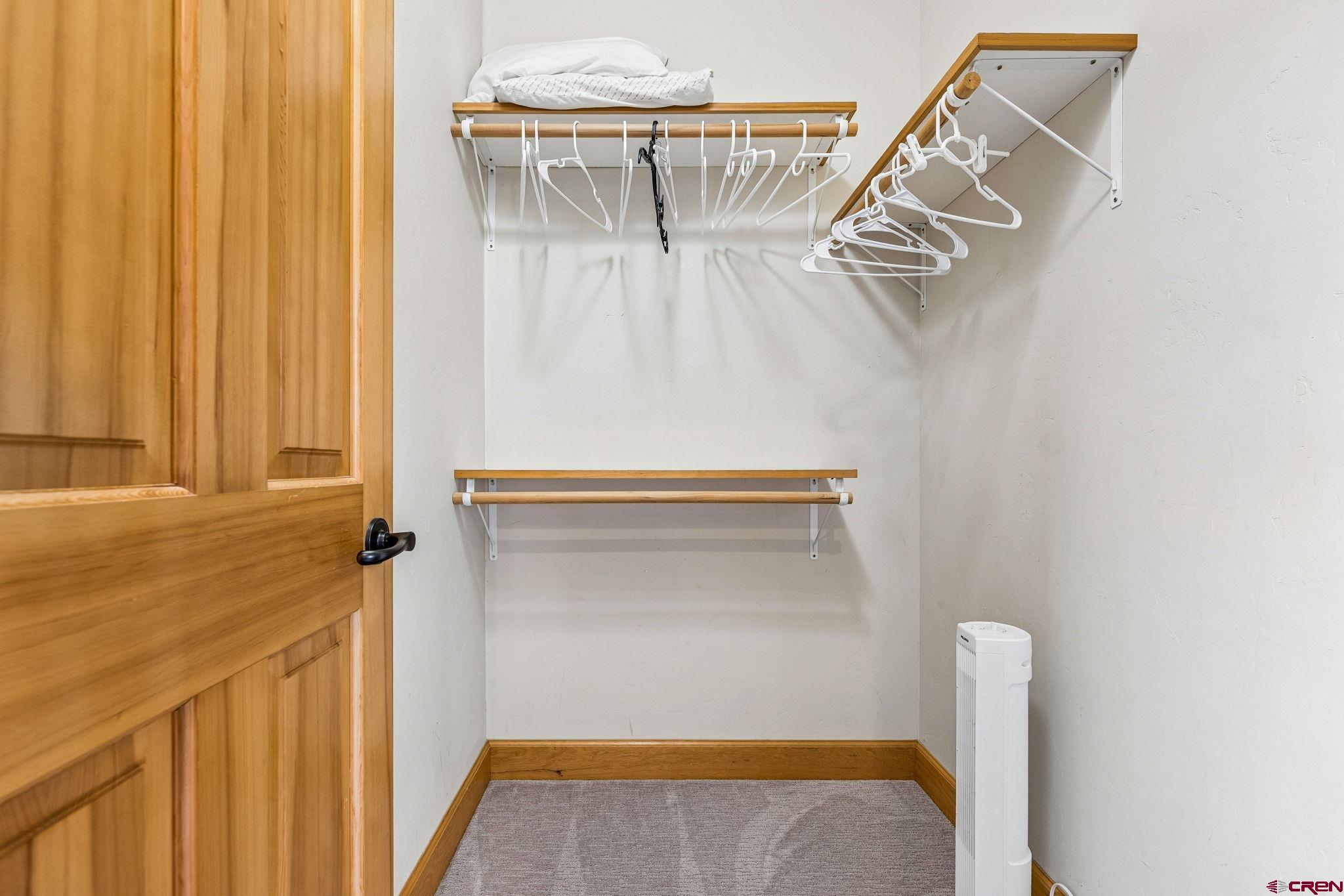 1422 Animas View Drive, Unit 55 Durango, CO 81301 - Photo 18 of 44 a view of walk in closet with clothes