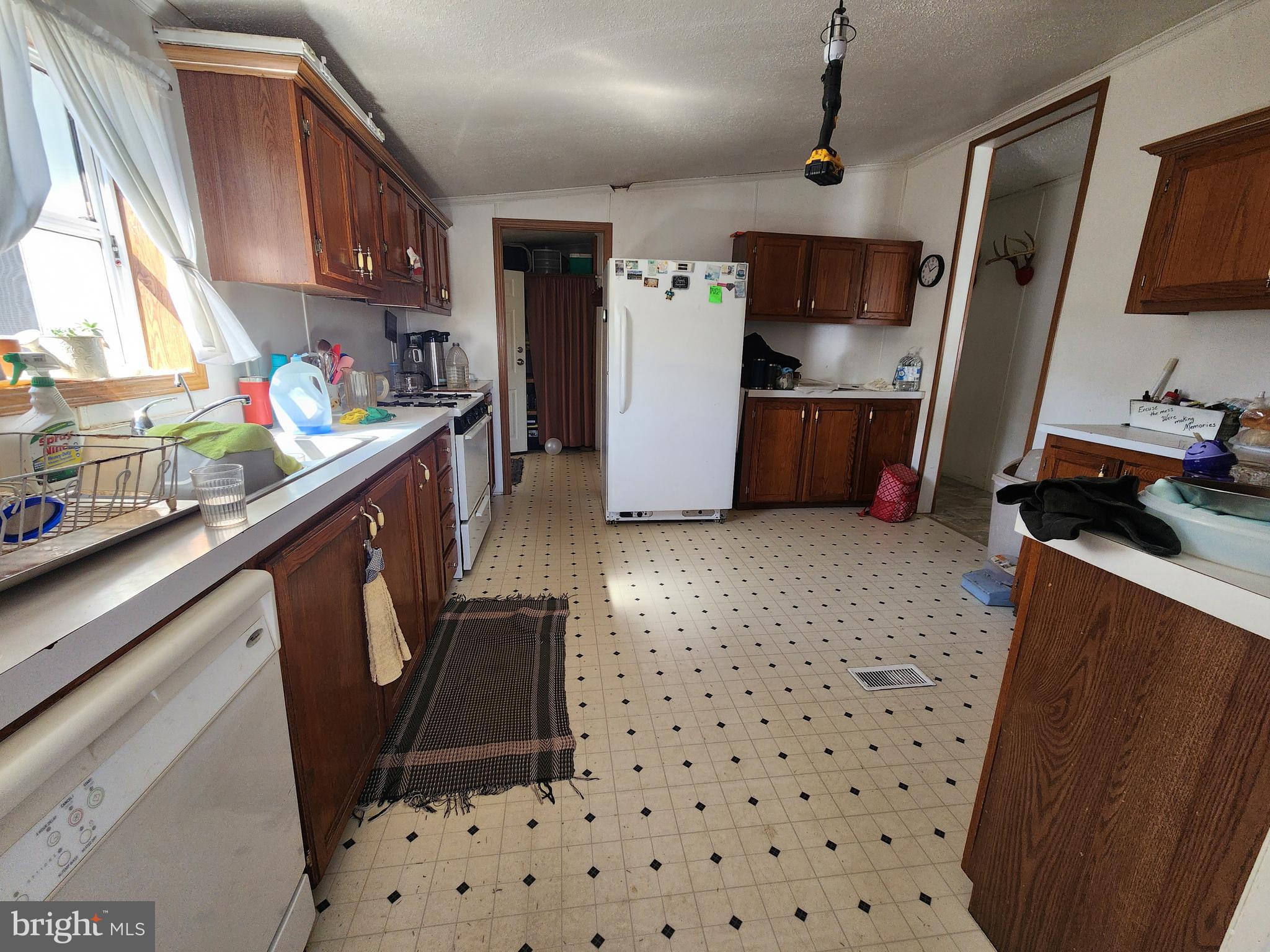 1337 Tower Road Camden Wyoming, DE 19934 - Photo 30 of 41 a kitchen with refrigerator and window