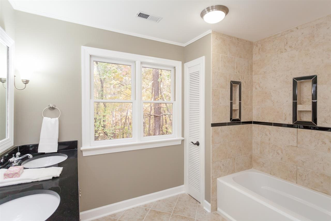 5516 North Hawthorne Park Raleigh, NC 27613 - Photo 12 of 25 Beautiful 2nd floor hall bath with ceramic tile surround, ceramic tile floor and granite countertop