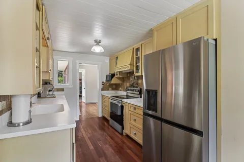 a view of a living room and hardwood floor