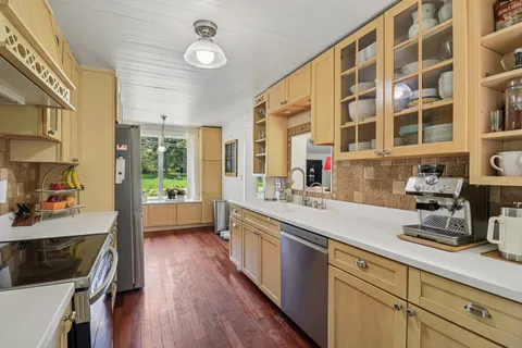 a kitchen with a sink and a refrigerator