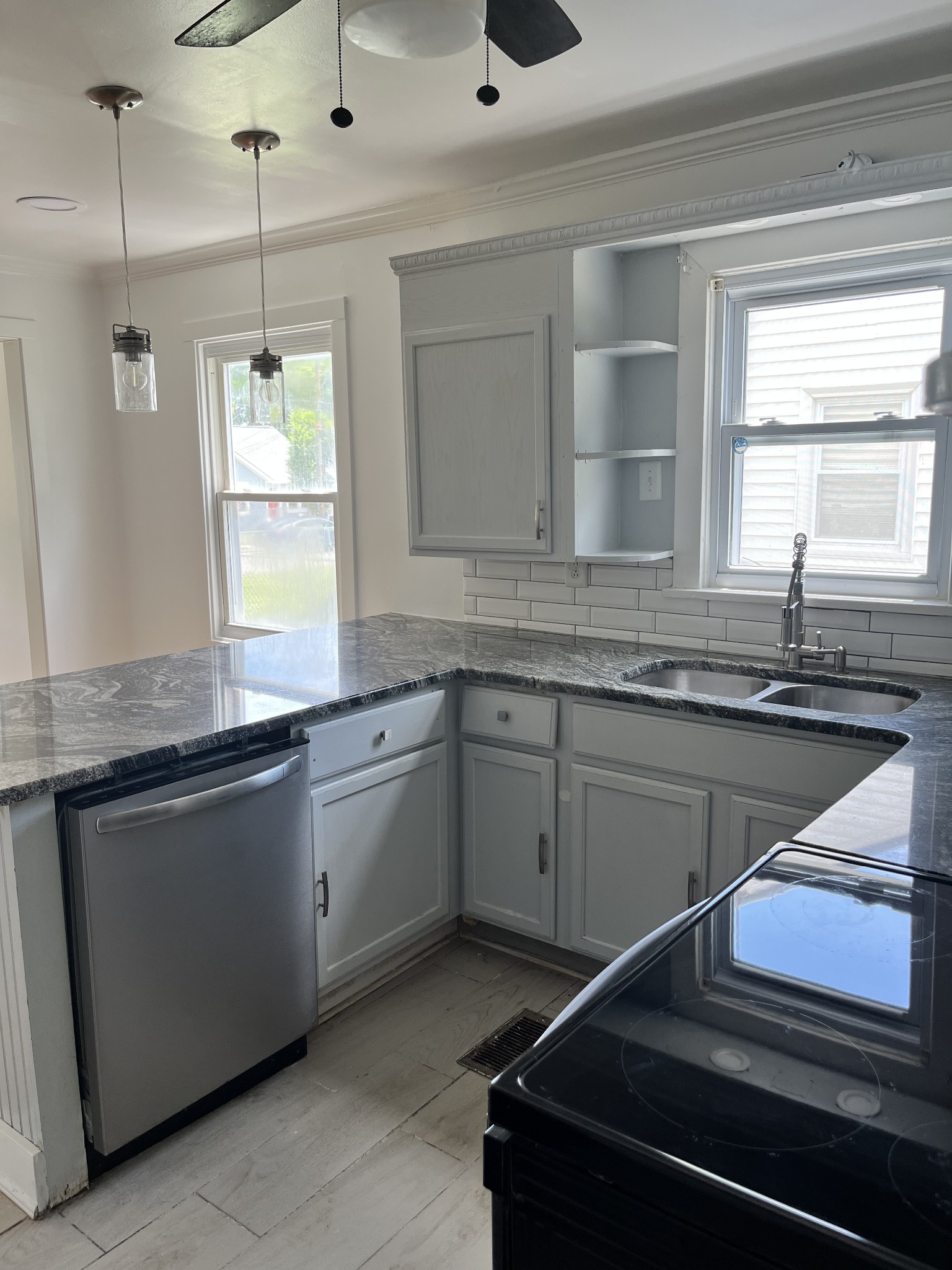 2002 Denham Avenue Columbia, TN 38401 - Photo 4 of 10 a kitchen with granite countertop stainless steel appliances sink and window