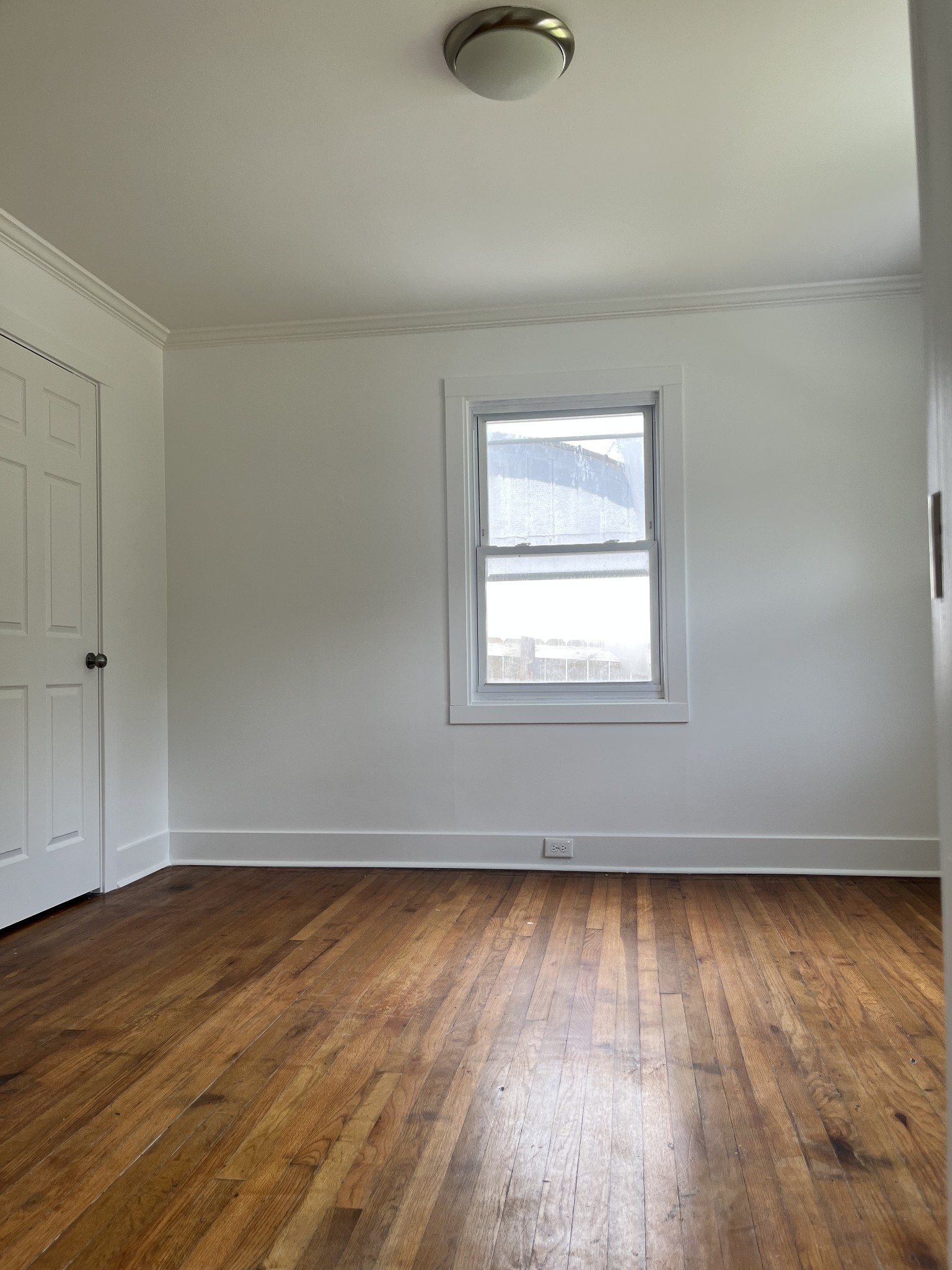 2002 Denham Avenue Columbia, TN 38401 - Photo 10 of 10 an empty room with wooden floor and windows