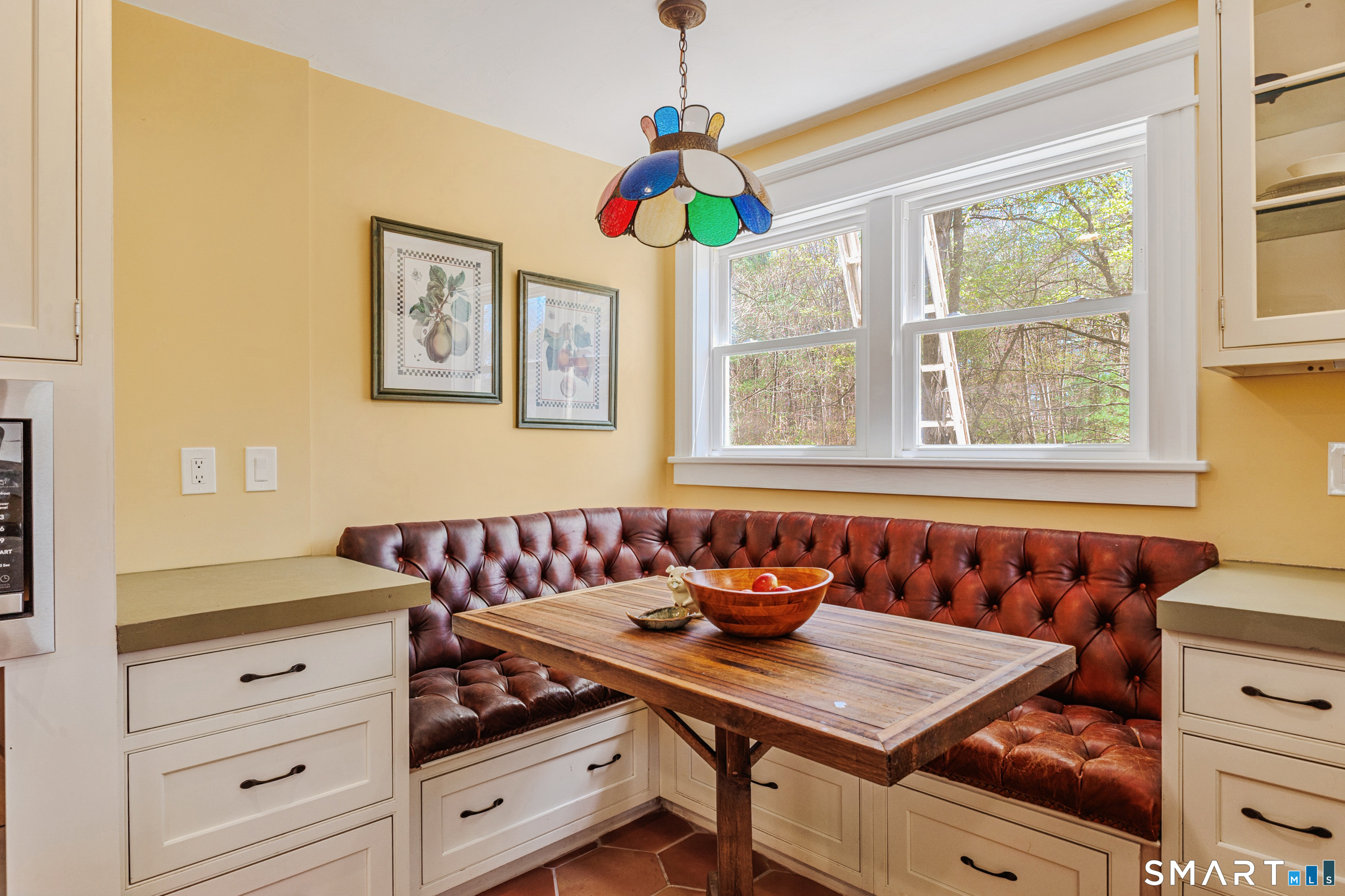760 Upper Maple Street Killingly, CT 06239 - Photo 17 of 34 a kitchen view of a dining table chairs and window