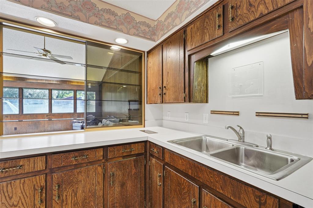 112 Virginia Lane Arlington, TX 76010 - Photo 14 of 39 a kitchen with a sink and cabinets