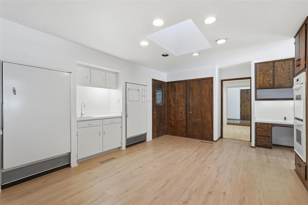 112 Virginia Lane Arlington, TX 76010 - Photo 16 of 39 a view of an empty room with a kitchen