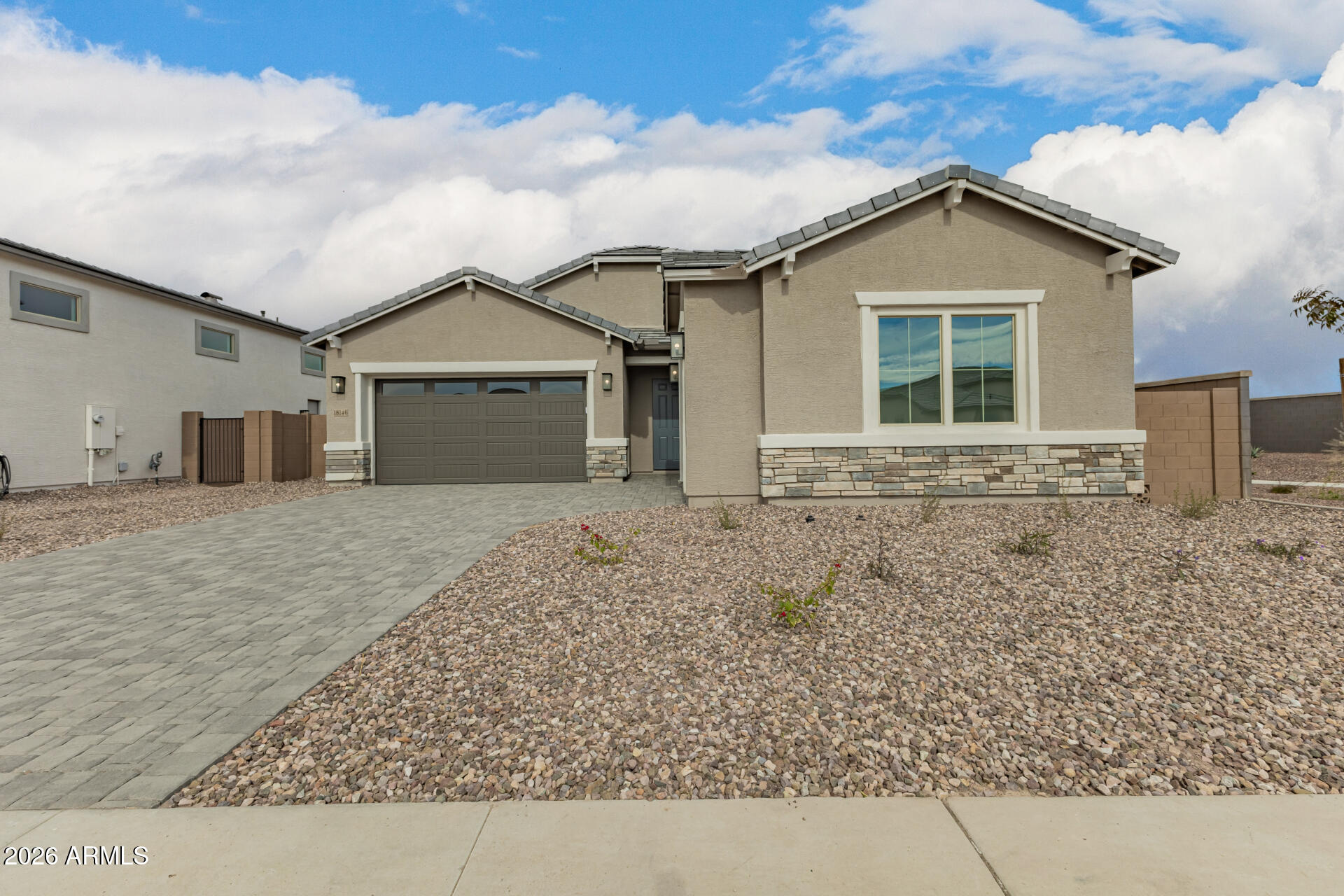 front view of a house with a yard