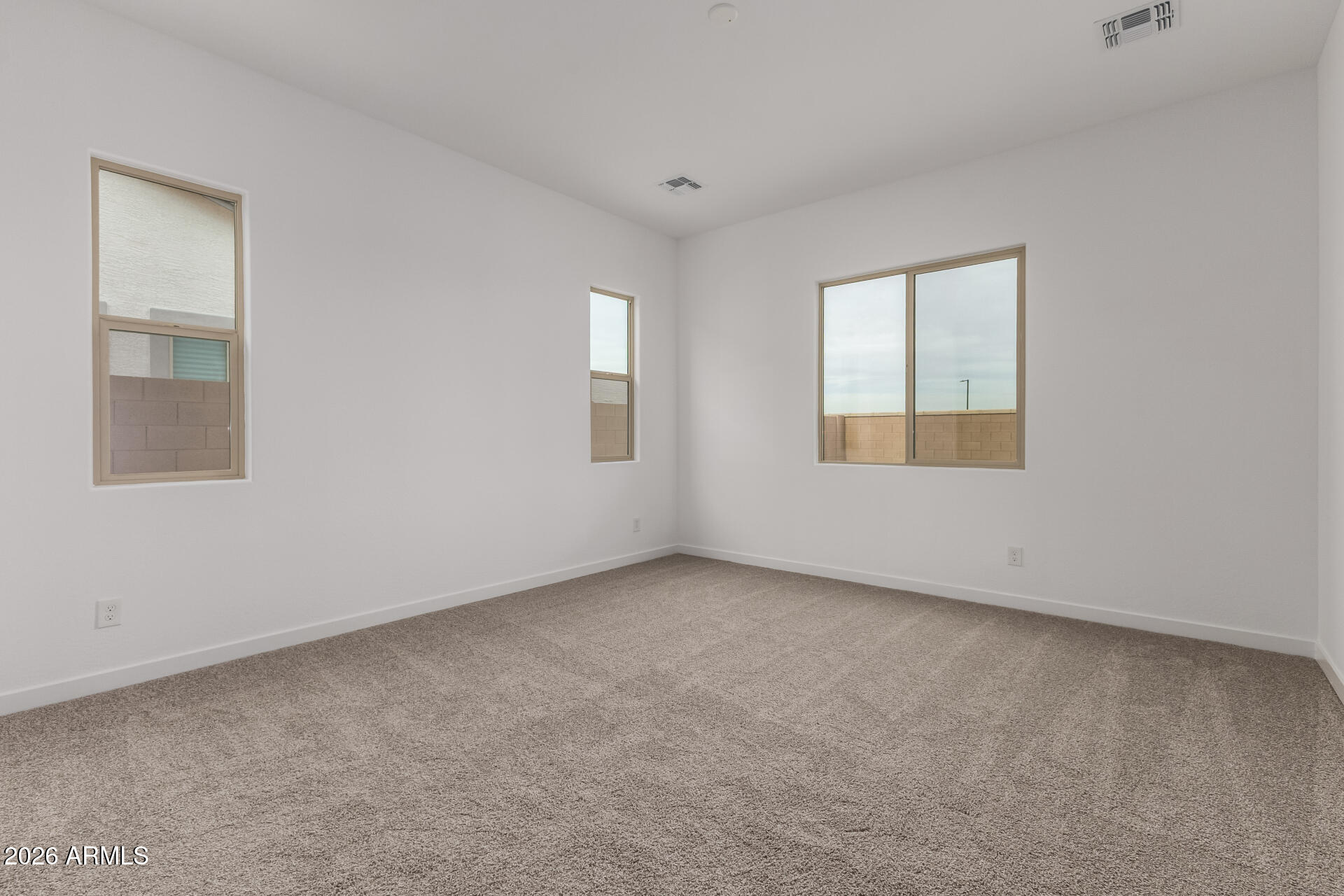 18146 West Watkins Street Goodyear, AZ 85338 - Photo 13 of 36 an empty room with a window