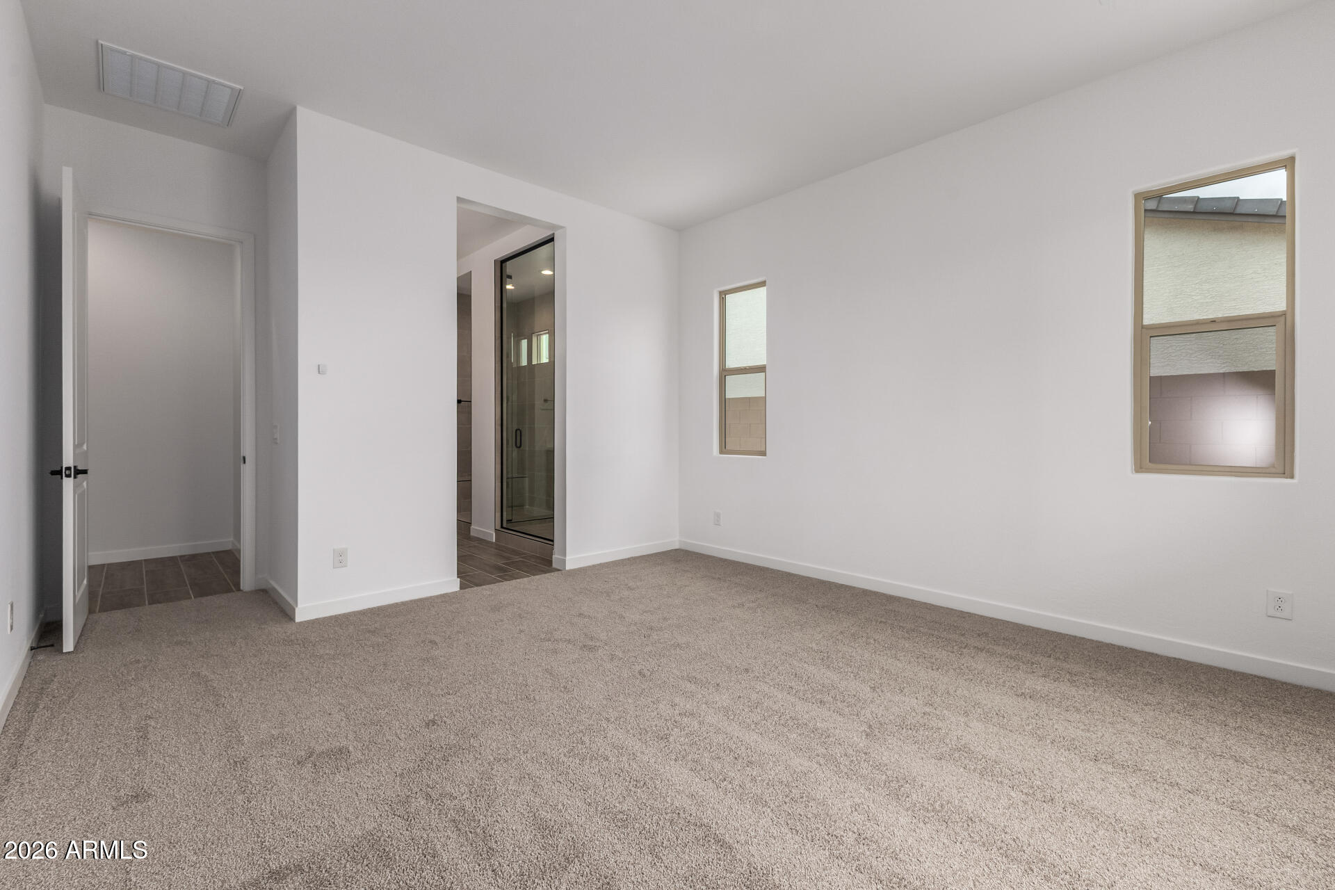 18146 West Watkins Street Goodyear, AZ 85338 - Photo 14 of 36 an empty room with windows and closet