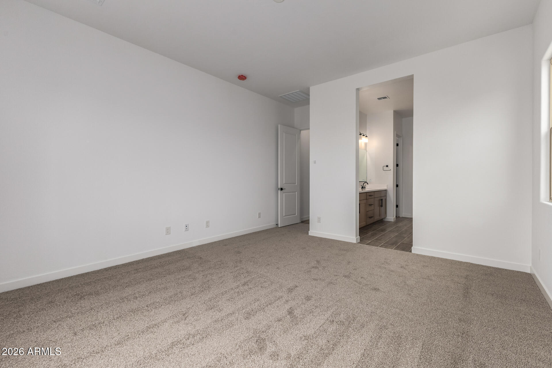 18146 West Watkins Street Goodyear, AZ 85338 - Photo 15 of 36 an empty room with an entrance