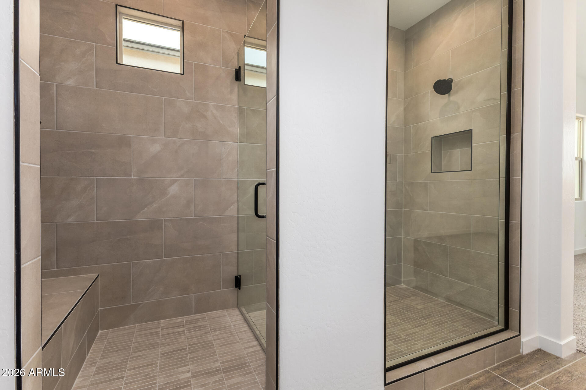 18146 West Watkins Street Goodyear, AZ 85338 - Photo 17 of 36 a bathroom with a glass shower door