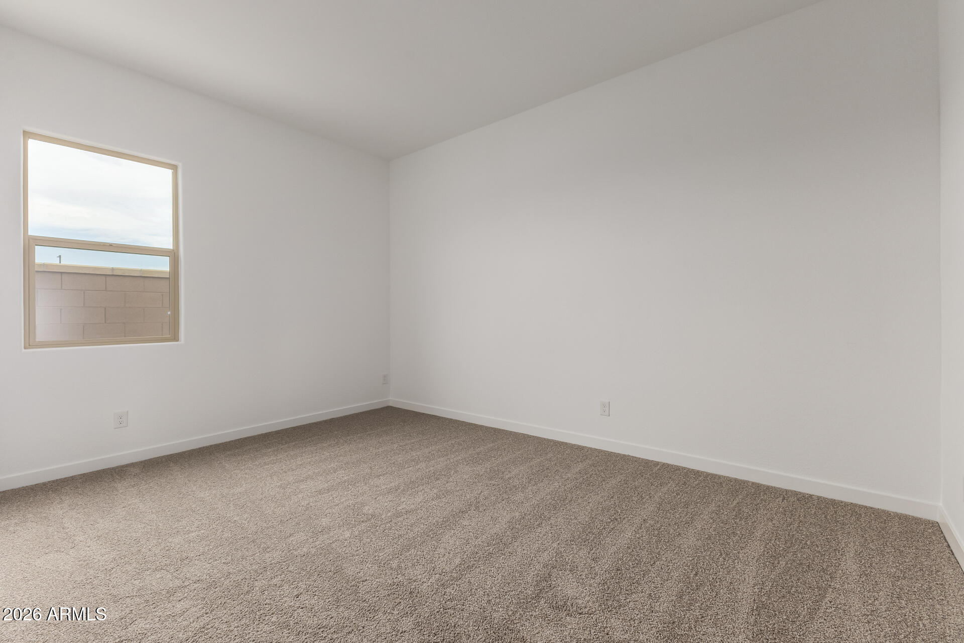 18146 West Watkins Street Goodyear, AZ 85338 - Photo 19 of 36 an empty room with a window