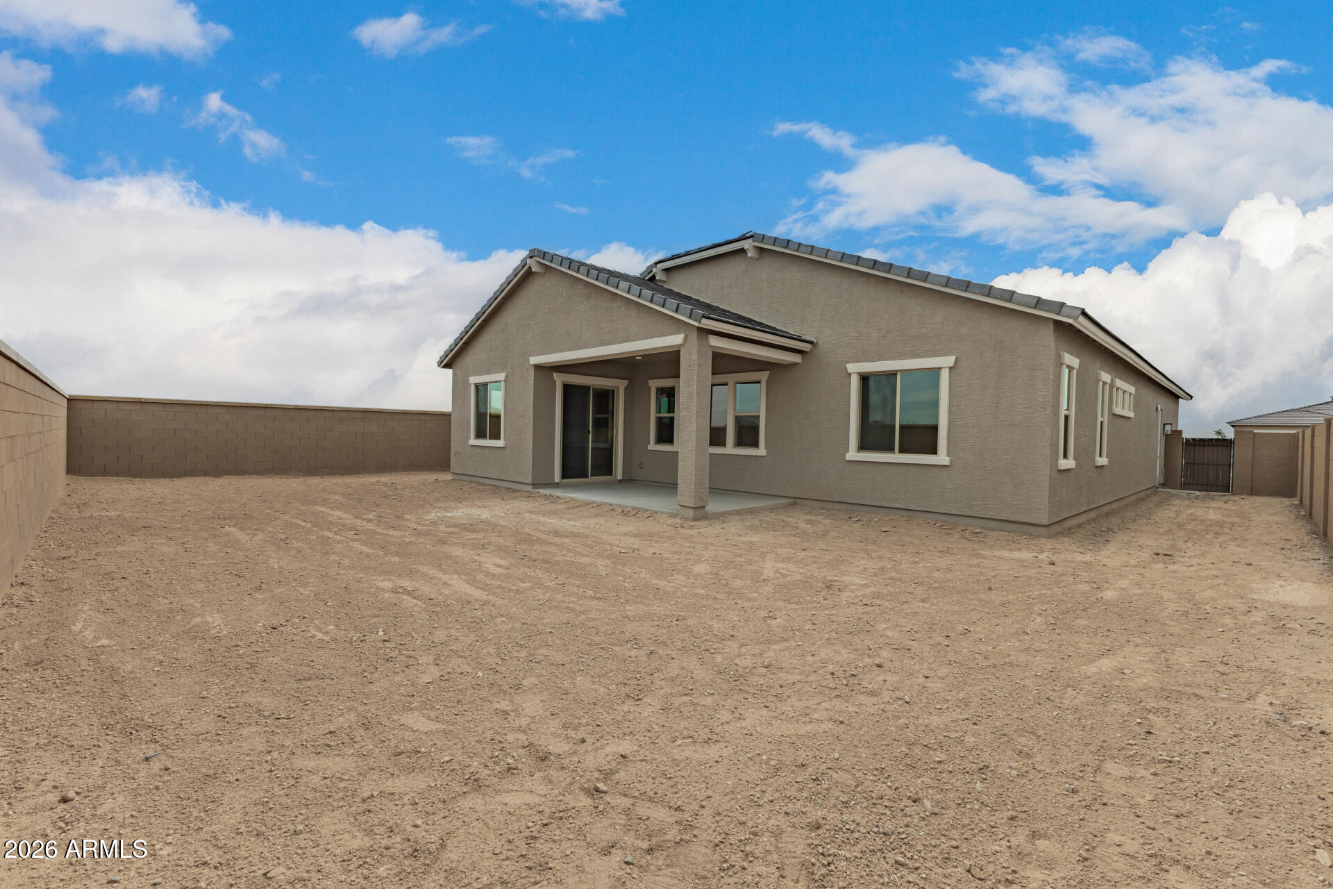 18146 West Watkins Street Goodyear, AZ 85338 - Photo 30 of 36 a front view of a house with a garden