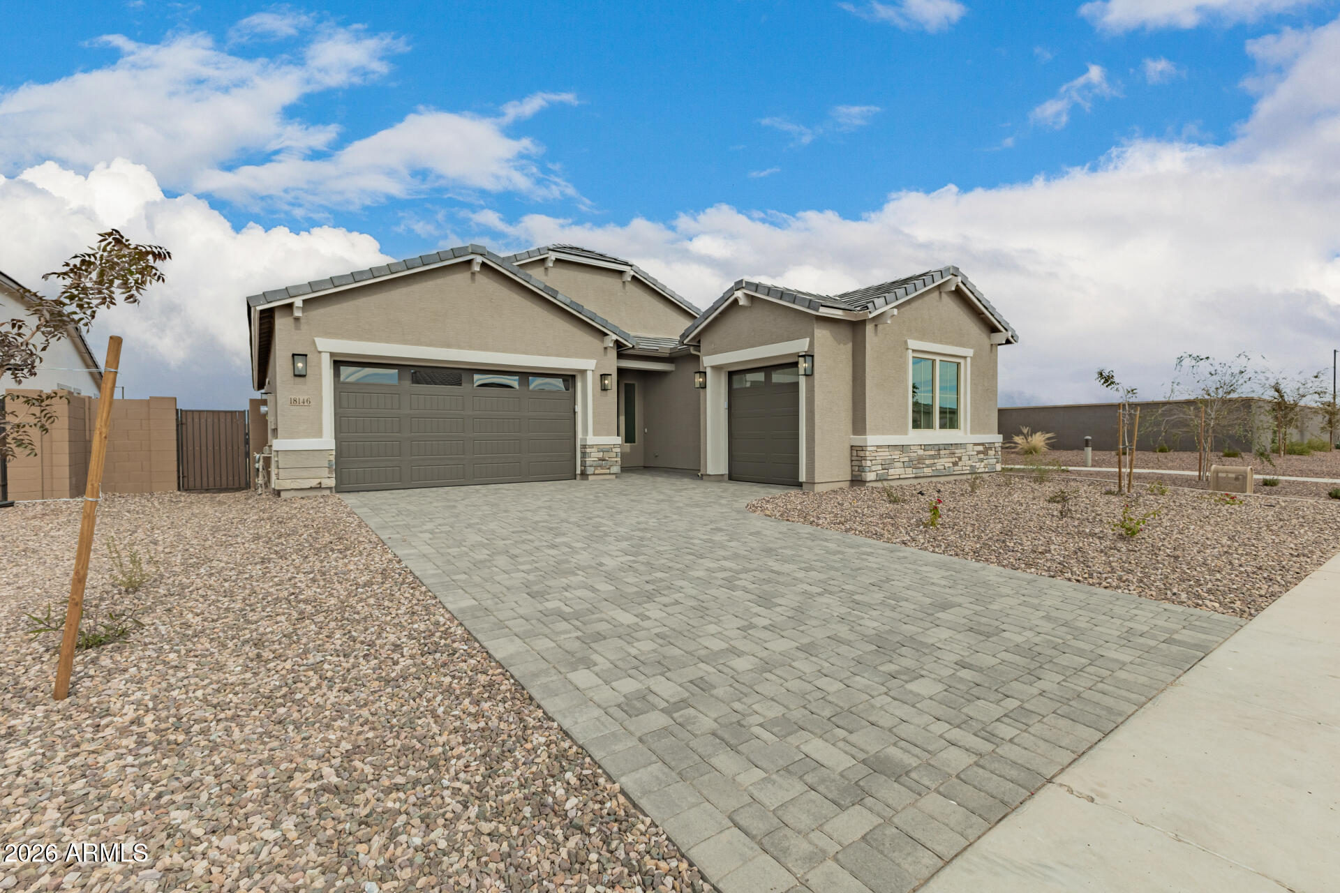 18146 West Watkins Street Goodyear, AZ 85338 - Photo 35 of 36 a front view of a house with a yard