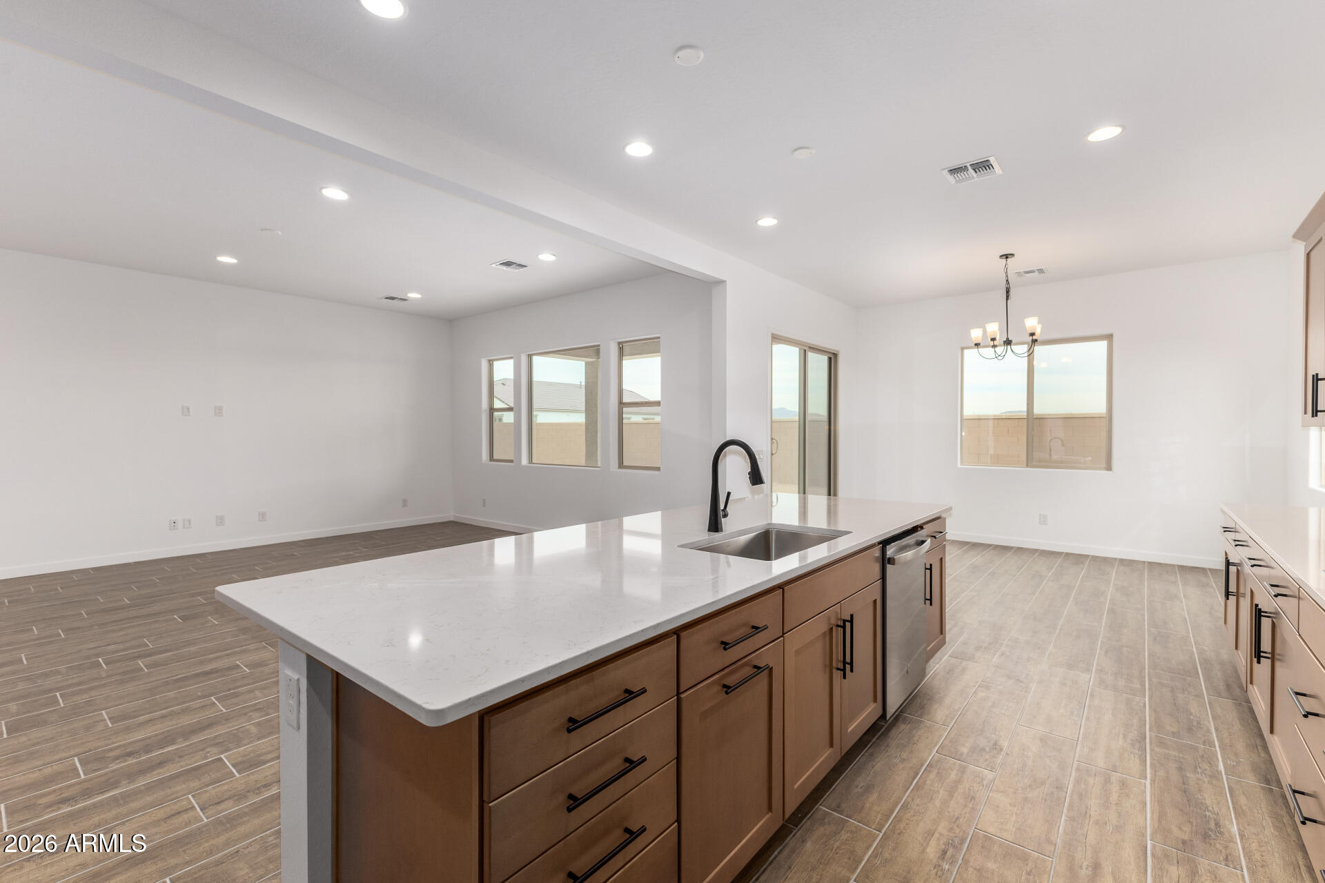 18146 West Watkins Street Goodyear, AZ 85338 - Photo 5 of 36 a kitchen with sink and mirror