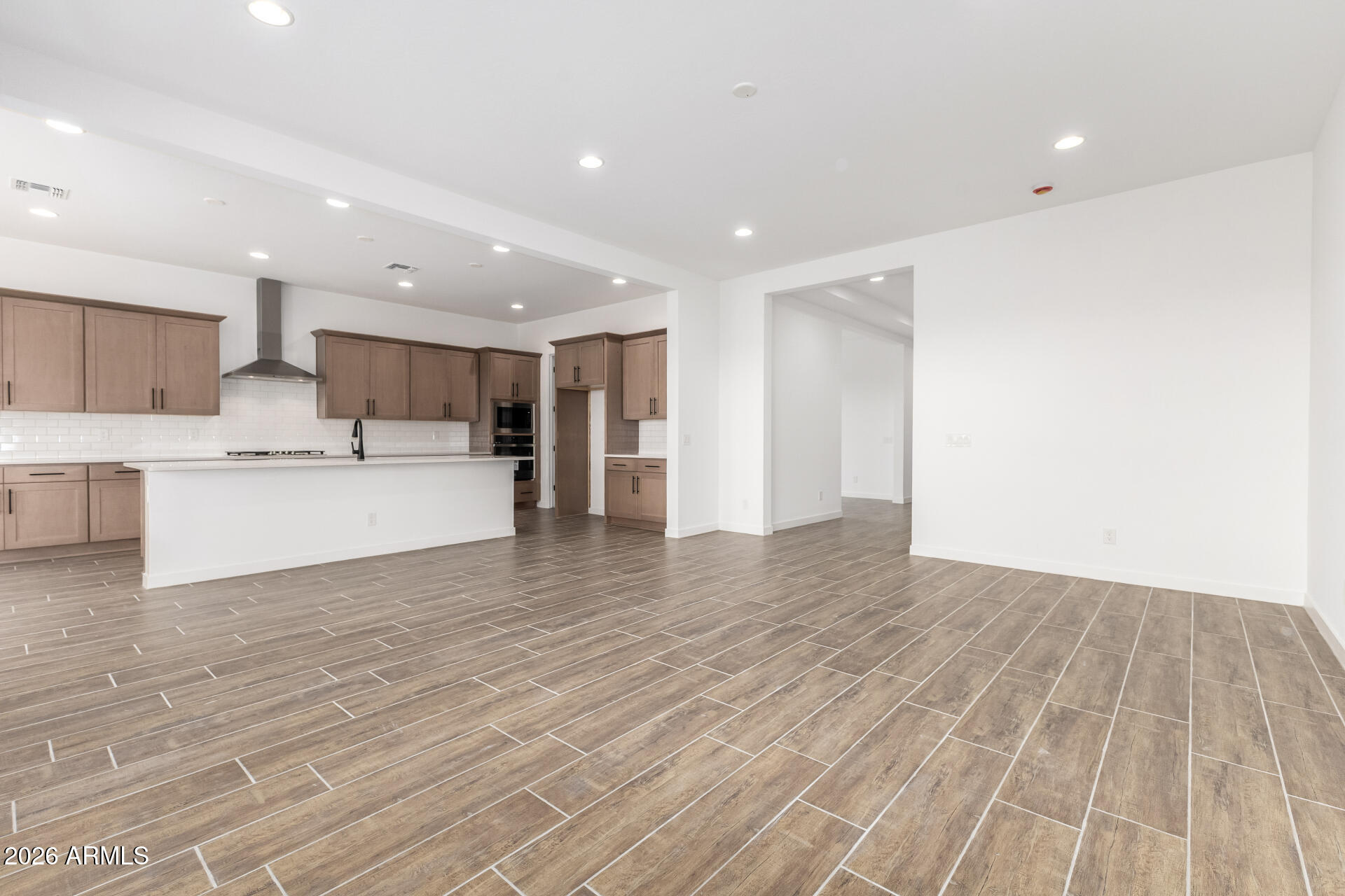18146 West Watkins Street Goodyear, AZ 85338 - Photo 6 of 36 a view of kitchen with wooden floor