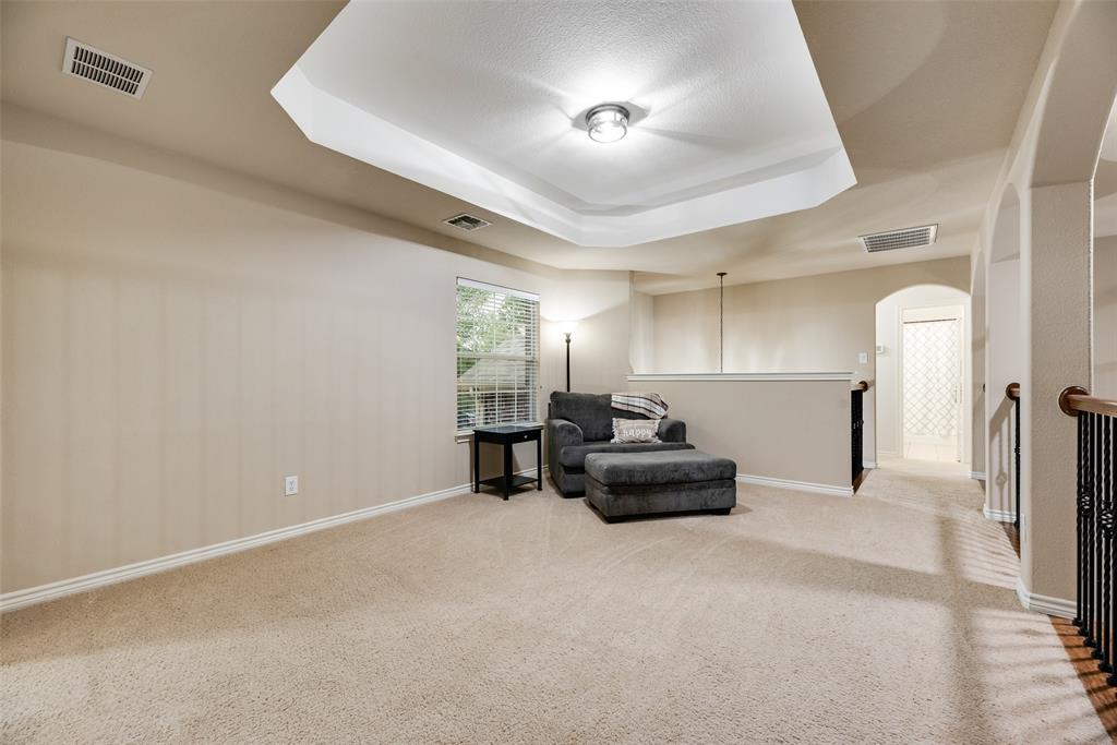 11920 Vienna Apple Road Fort Worth, TX 76244 - Photo 31 of 40 Upstairs game room with reinforced floors and tiered ceiling at 11920 Vienna Apple in Villages of Woodland Springs community in North Fort Worth