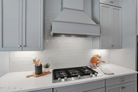 a bathroom with a shower and a sink