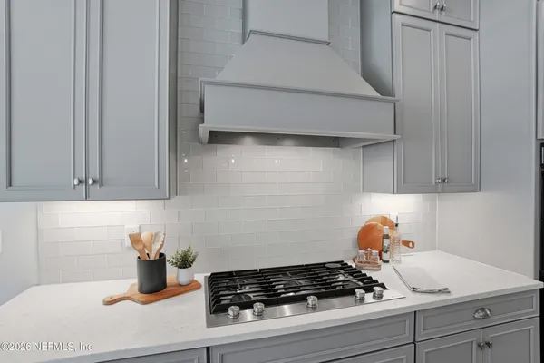 a bathroom with a shower and a sink