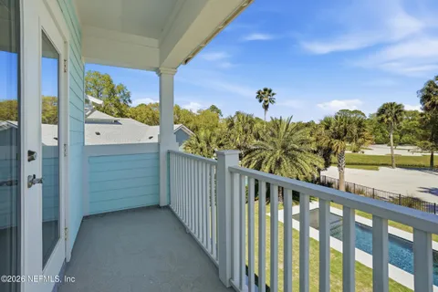 an aerial view of multiple houses with yard
