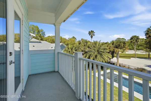 an aerial view of multiple houses with yard