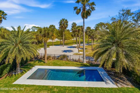an aerial view of a residential houses with outdoor space