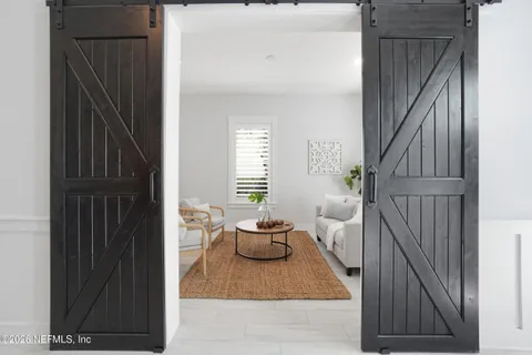 a kitchen with a refrigerator and a sink