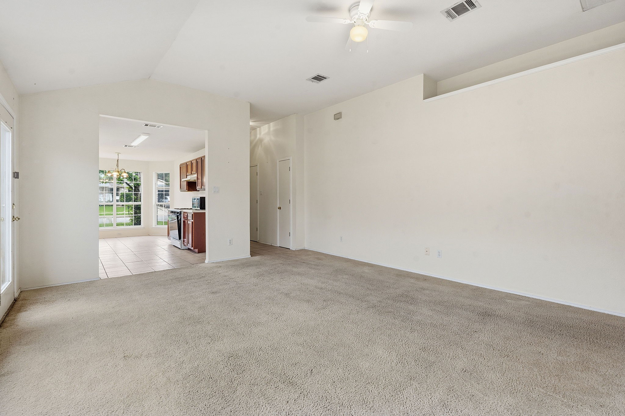116 Blue Ridge Trail Elgin, TX 78621 - Photo 7 of 28 an empty room with windows and entrance