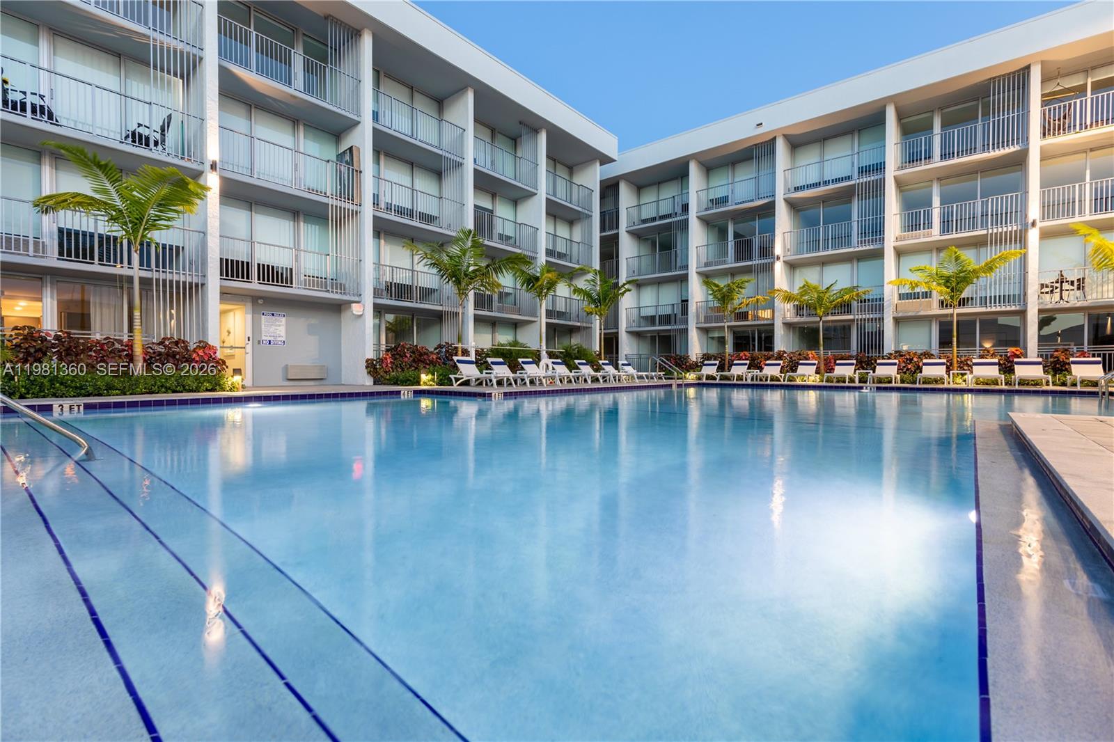 1950 West 49th Street, Unit 455 Hialeah, FL 33012 - Photo 18 of 30 a view of building with lake view