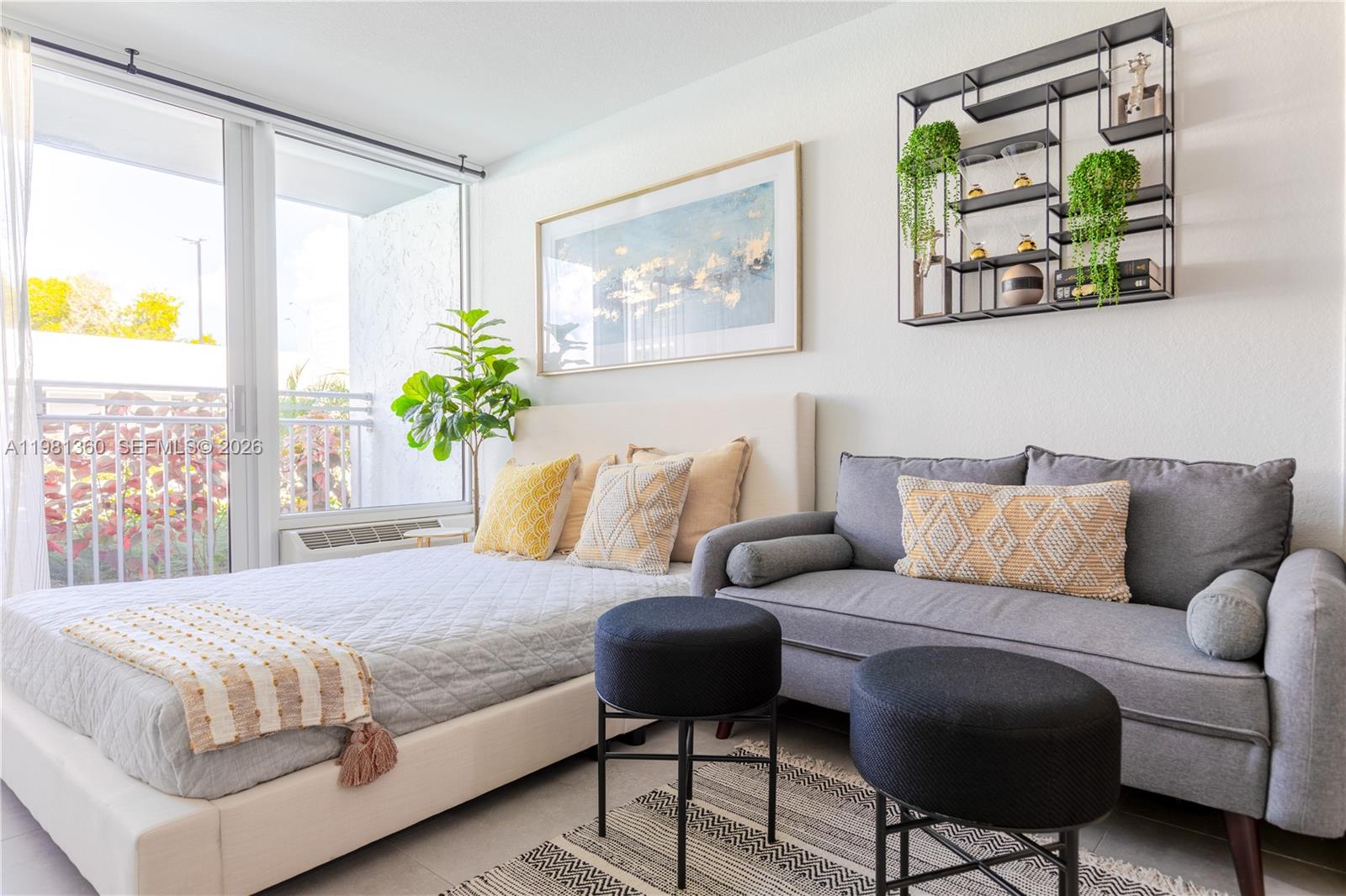 1950 West 49th Street, Unit 455 Hialeah, FL 33012 - Photo 3 of 30 a bedroom with a bed painting on wall and a large window