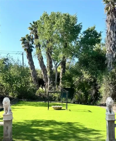 a view of swimming pool with a yard