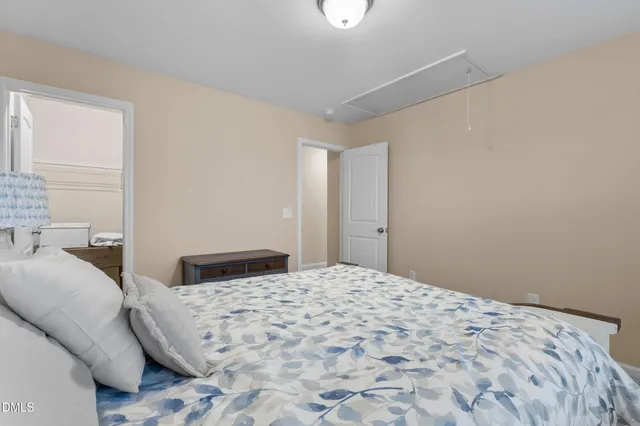 a bed room with a bed and a window