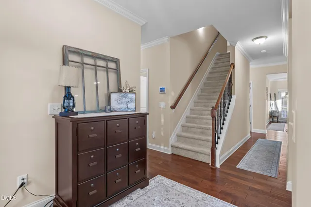 a spacious bedroom with a bed and a flat screen tv