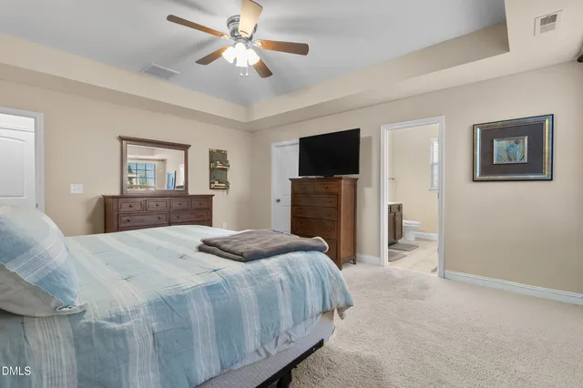 a view of bathroom with a sink mirror and window