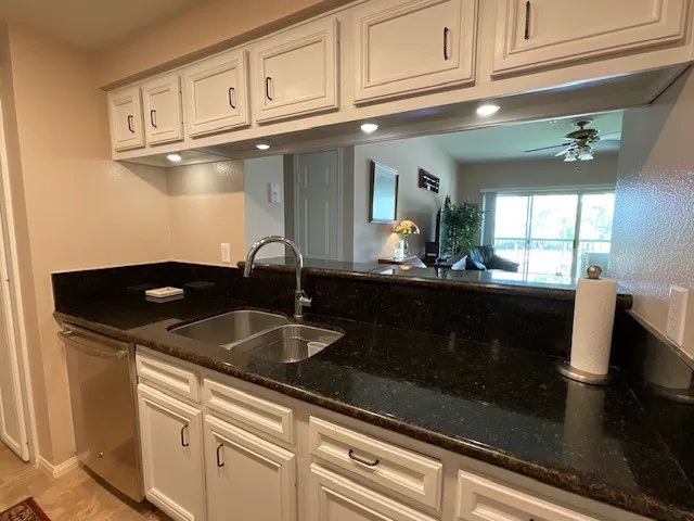 a living room with furniture rug and window
