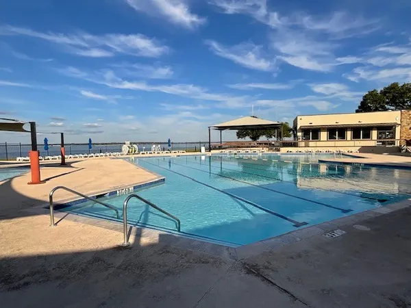 a bed room with a bed window and a mirror