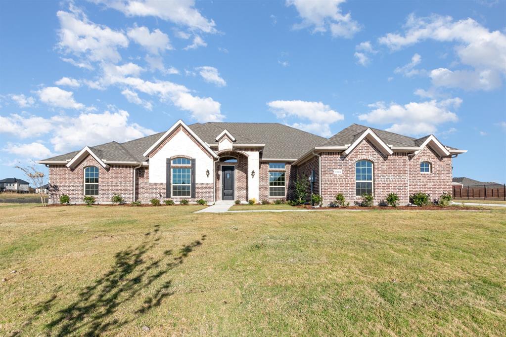1509 Lynx Loop Forney, TX 75126 - Photo 2 of 30 a view of a house with a yard and wooden fence