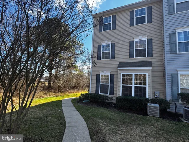 a view of a house with backyard and swimming pool