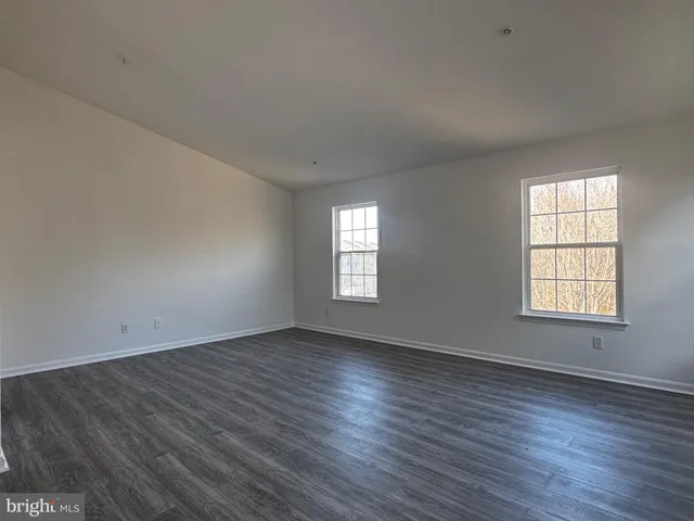 a view of a livingroom with wooden floor
