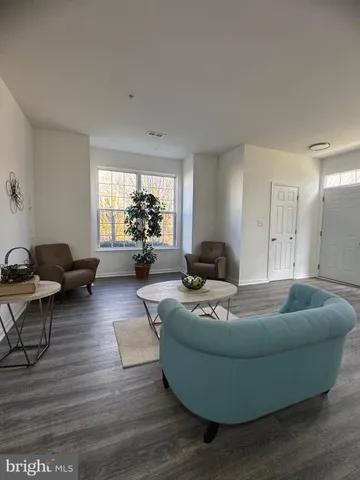 a kitchen with a refrigerator a stove a microwave and cabinets