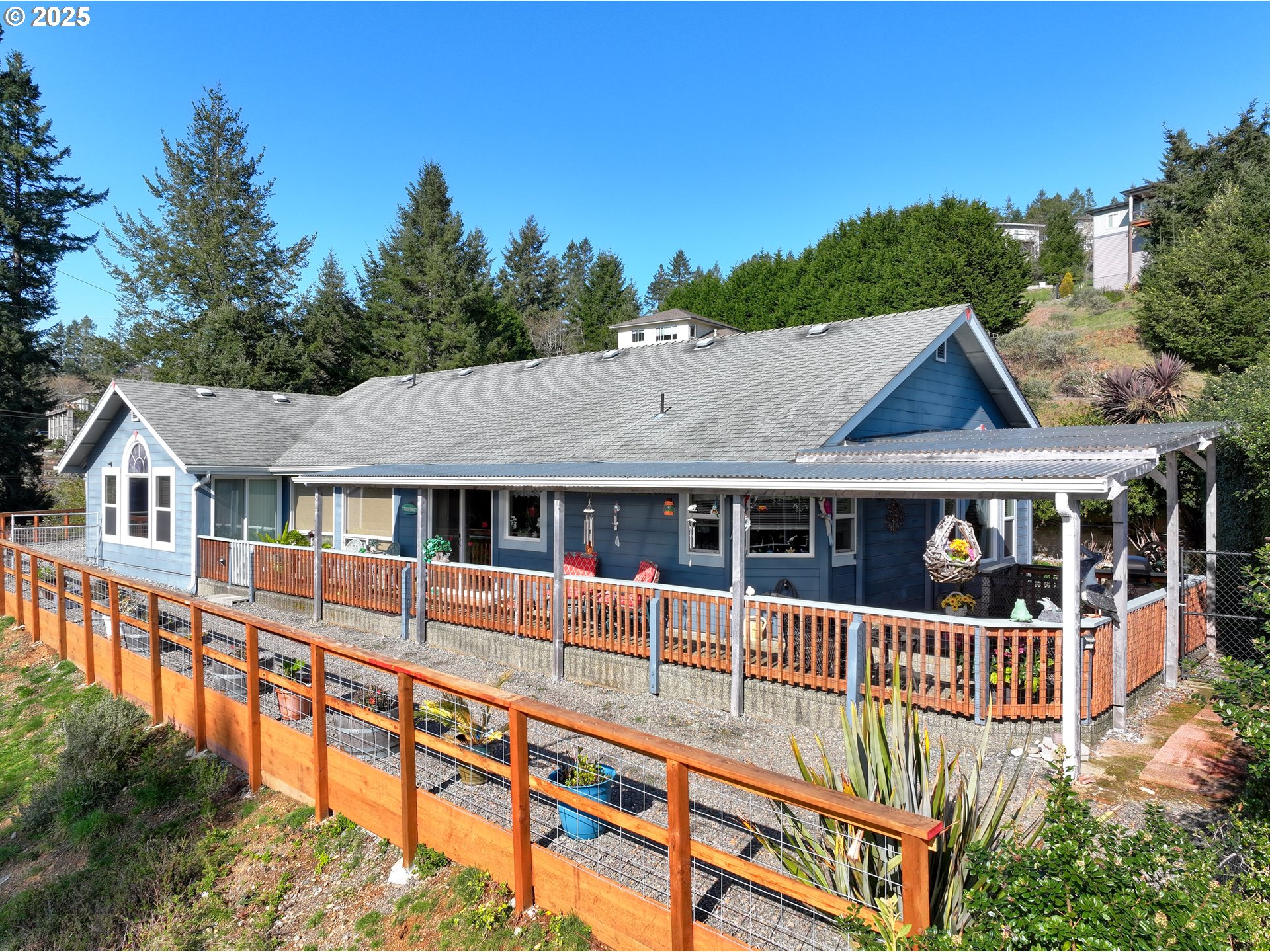 838 Marina Heights Road Brookings, OR 97415 - Photo 1 of 47 front view of a house with a small yard