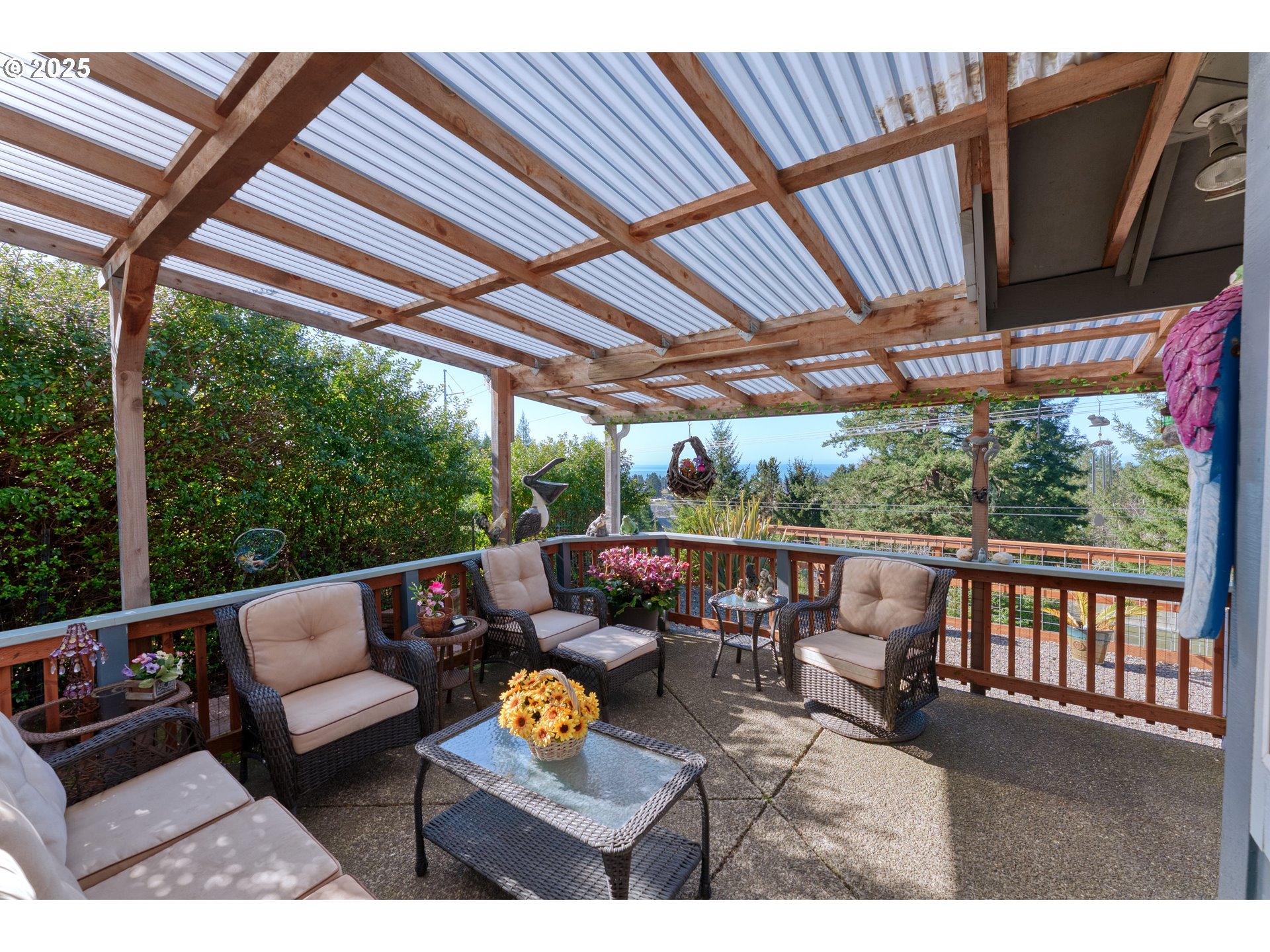 838 Marina Heights Road Brookings, OR 97415 - Photo 11 of 47 a outdoor living space with furniture and garden view