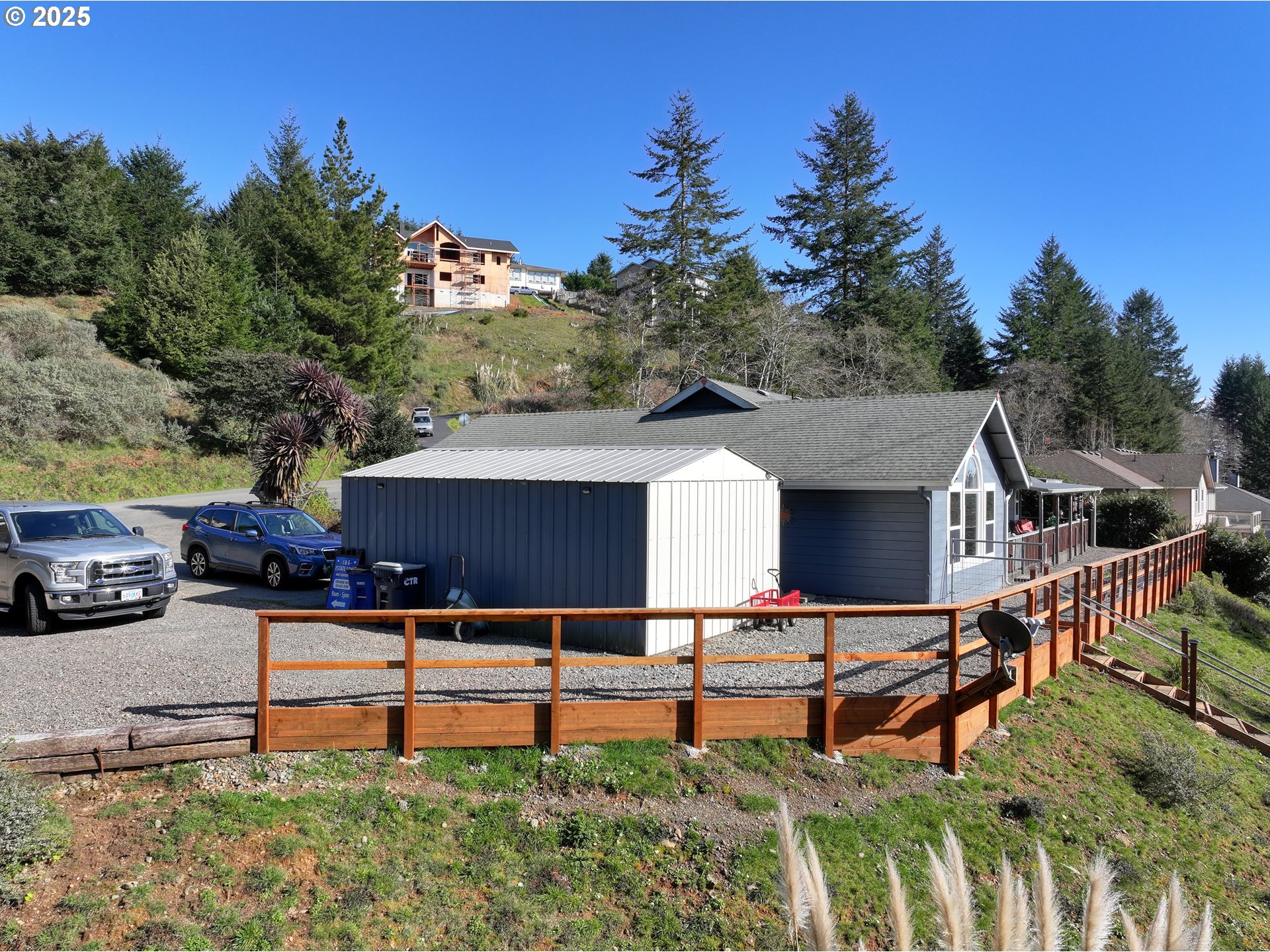 838 Marina Heights Road Brookings, OR 97415 - Photo 12 of 47 a house view with a garden space