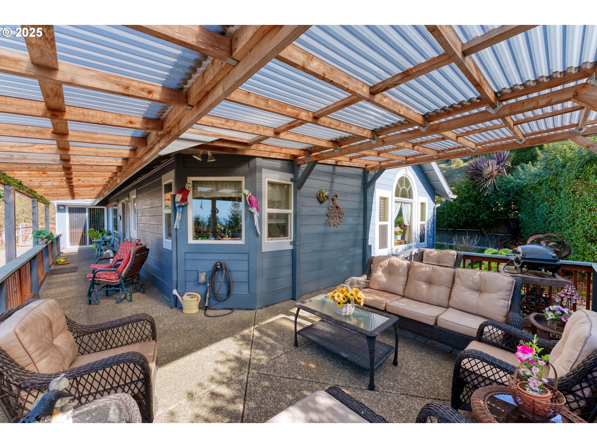 838 Marina Heights Road Brookings, OR 97415 - Photo 13 of 47 a outdoor living space with patio furniture